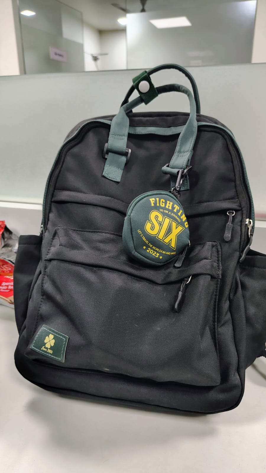 Black Backpack with Green Accents and Detachable Pouch