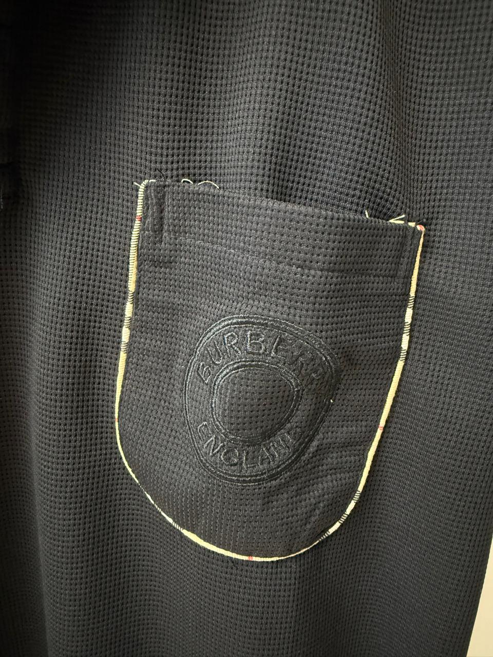 Burberry Men's Black Waffle Knit Polo Shirt with Nova Check Trim