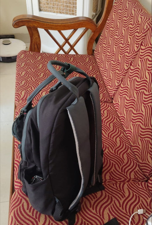 Black Backpack with Green Accents and Detachable Pouch