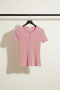 A pink short-sleeve ribbed knit cardigan top with a button-up front, laid flat on a light gray fabric background.
